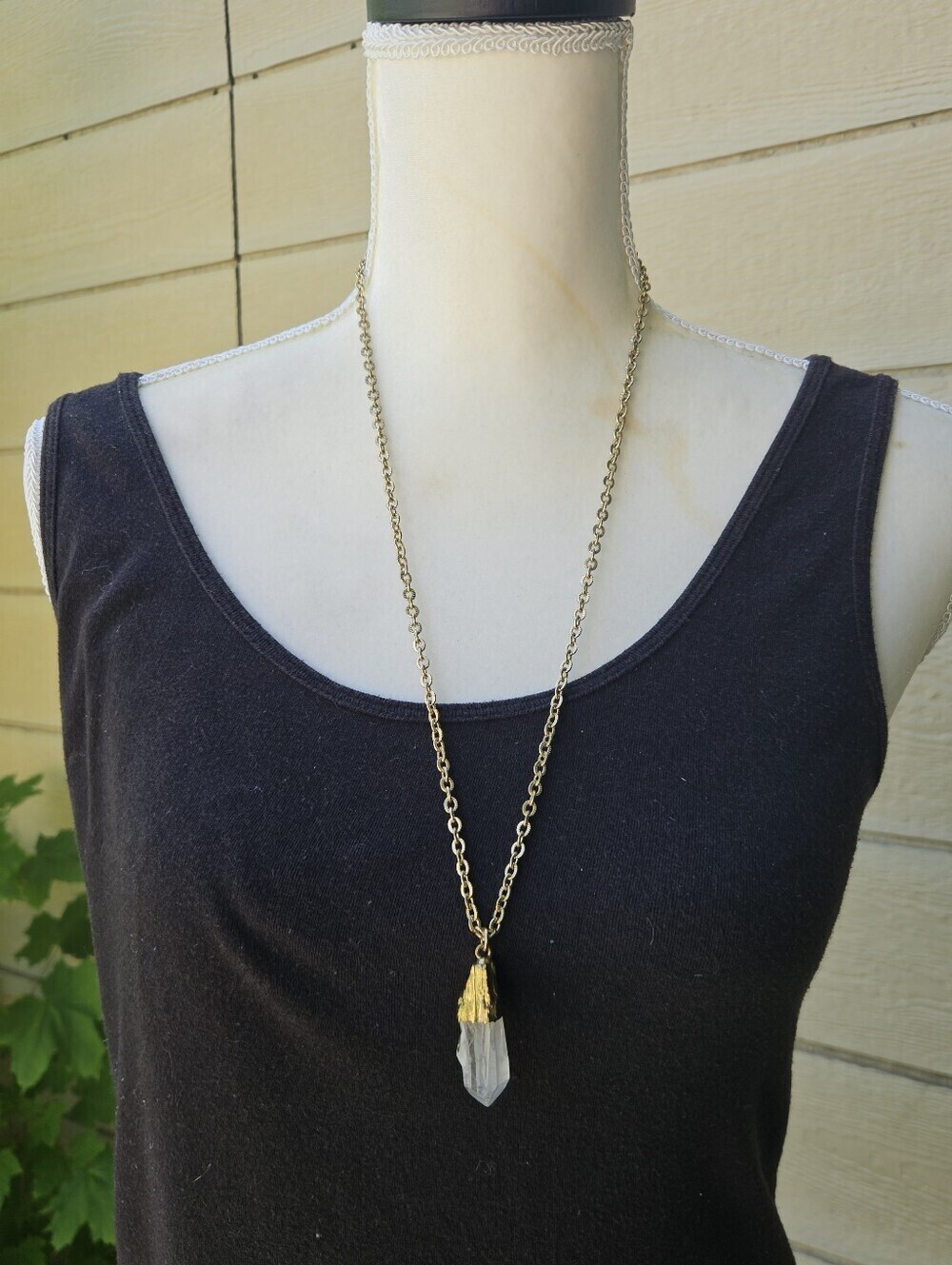 gold tone chain necklace with clear gold-dipped quartz crystal